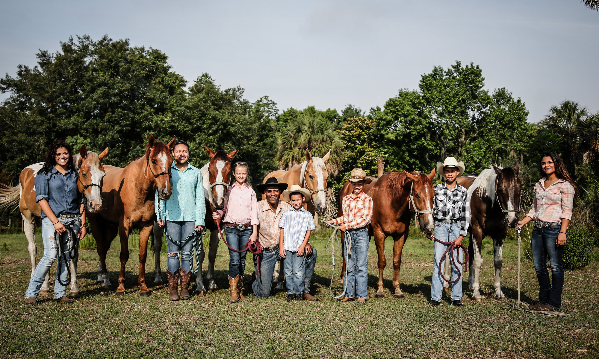 Young riders and mentors of the Gus Trent Rodeo Association with their horses